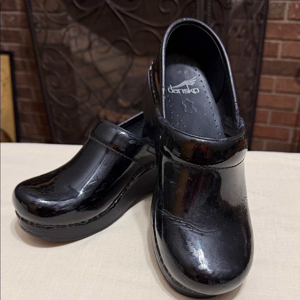 Dansko Woman’s Black Patent Leather Slip-On Clogs, Size 36 (6-6.5 USA)